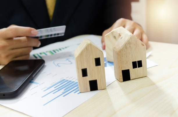 Real estate business profit and loss report business graph.Pay for home bills by credit card.