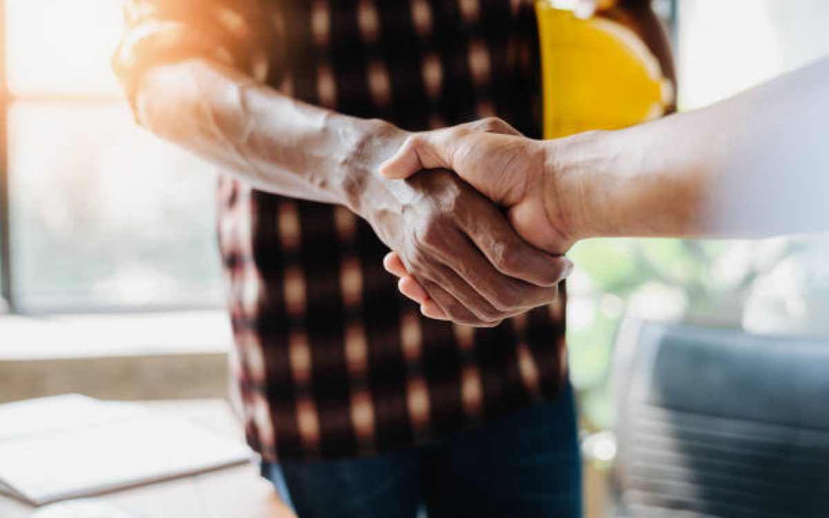 Negotiating business,Image of businessmen Handshaking,happy with work,Handshake Gesturing People Connection Deal Concept.