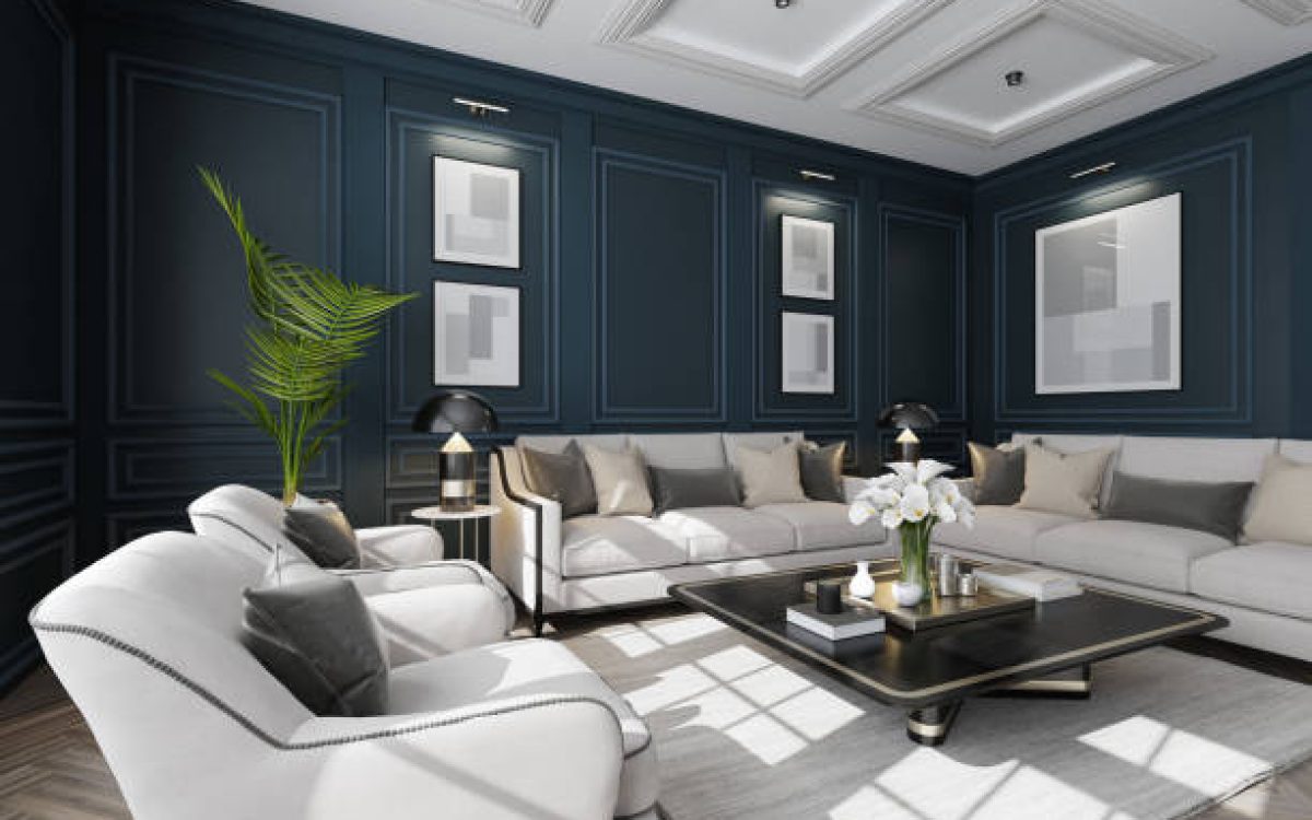 Experience the charm of modern neo-classical Parisian interior design with this luxurious living room setup. The space features classic wall moulding dark royal blue plaster design and large classic windows that flood the room with natural light. The sophisticated white and beige color palette is complemented by plush pillows and sleek modern furniture. A stylish living room table with golden accents and a striking vase filled with white flowers add the finishing touches. This image is ideal for showcasing modern furniture, elegant decor, clean design, cozy room ideas, and renovation projects with a modern classic style.