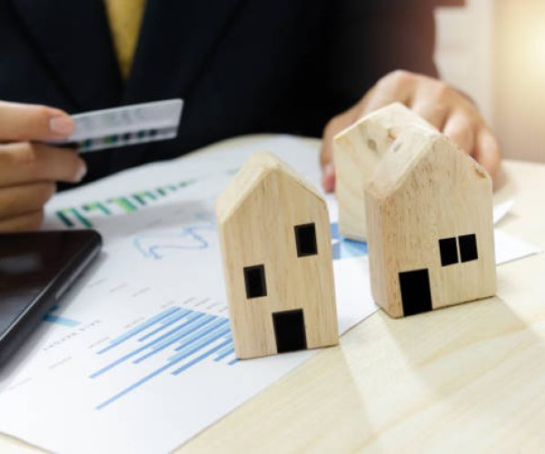 Real estate business profit and loss report business graph.Pay for home bills by credit card.